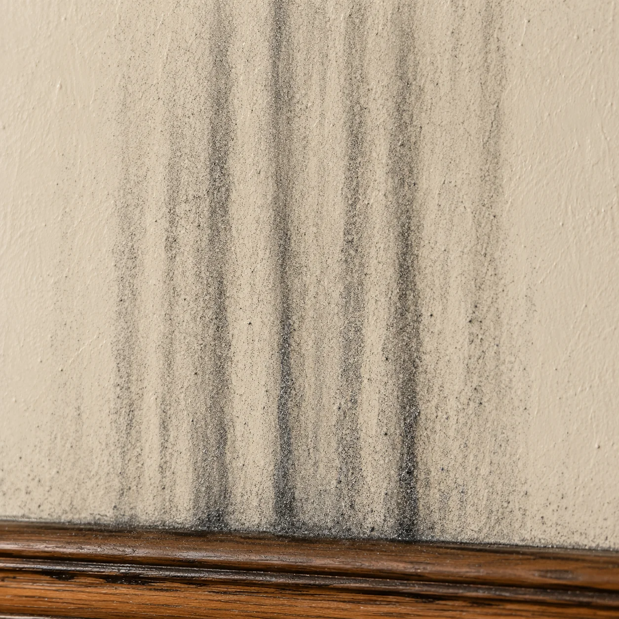 Mold quiz card 6: soot streaks above a fireplace (NOT mold) (lok6)